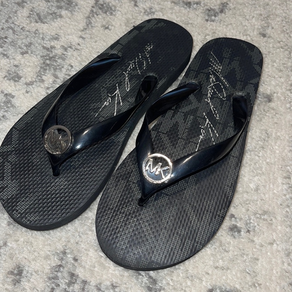 Michael Kors flip flops. Perfect condition. Size 9.5